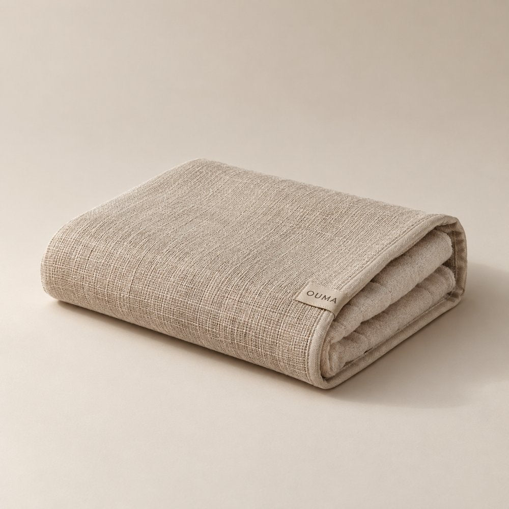 OUMA Sauna Towel in beige — AI-generated illustration