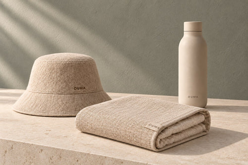 OUMA bundle in beige with contrasting sage-grey background — AI-generated product concept.